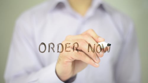 Hand Writes Order Now on Transparent Surface