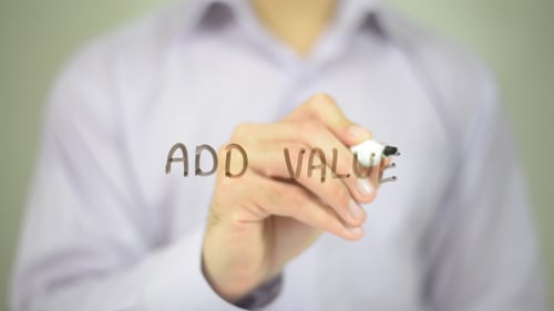 Hand Writes Add Value on Transparent Glass