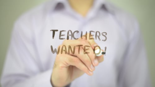 Teachers Wanted Written on Glass