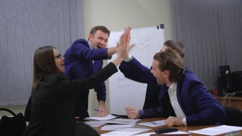 Business Team Celebration in Conference Room