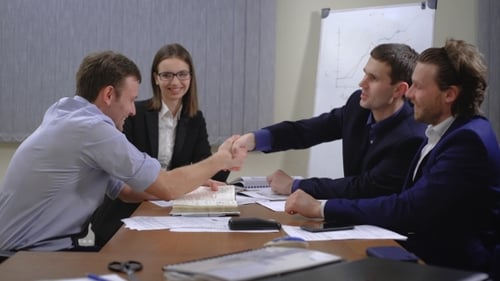 Business Meeting Handshake at Conference Table