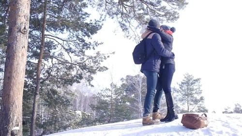 Young And Beautiful Couple In Love Walking In The Winter Woods