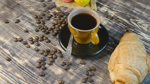 Coffee Cup with Coffee Beans and Pastries