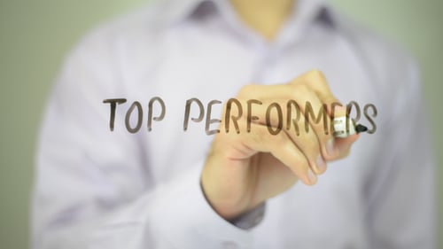 Hand Writes Top Performers on Clear Surface