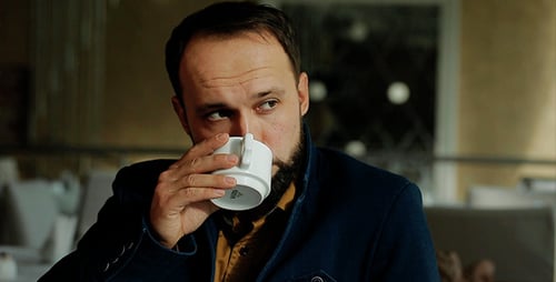 The Middle Aged Businessman Working In Coffee Shop