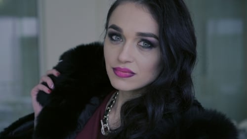 Portrait Of Smart Woman In Expensive Fur Poses To The Camera.