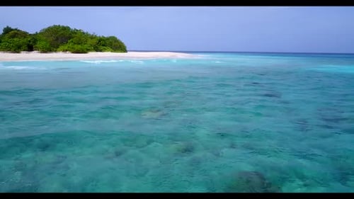 Aerial drone scenery of marine shore beach break by turquoise sea with white sand background of a da