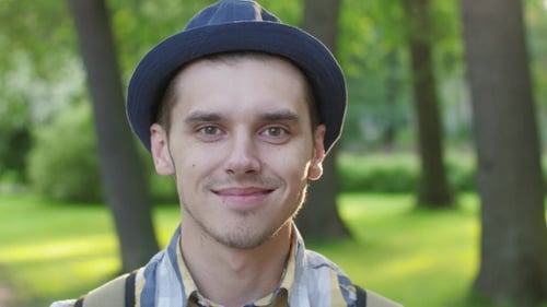 Young Adult Smiling Close Up in Park Setting