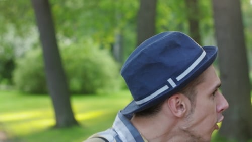 Portrait of Boy in Hat Turn Head, Catch Camera and Smile
