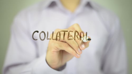 Hand Writes Collateral with Marker