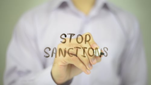 Stop Sanctions Written on Glass