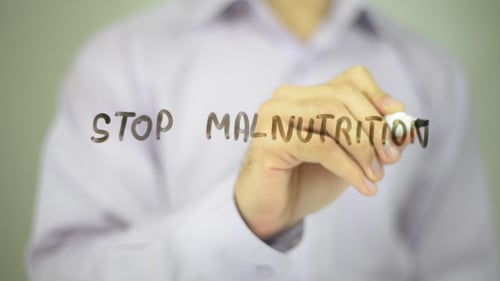 Writing the Words Stop Malnutrition