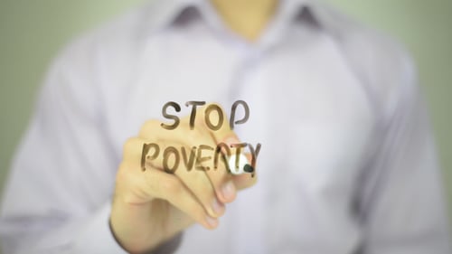 Stop Poverty Message Written on Glass