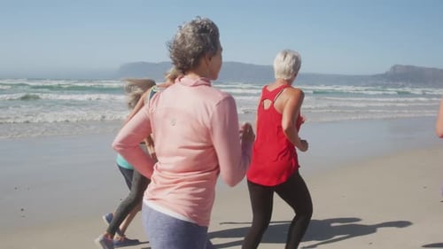 Athletic women running on the beach