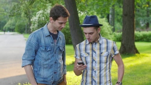 Boy Come To Friend With Phone, Explain Him Something About Device