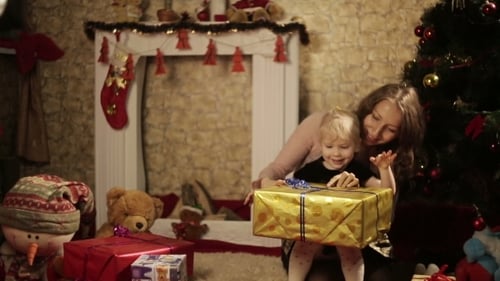 Mother and Child Opening Christmas Gifts at Home