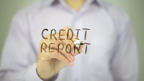 Hand Writes Credit Report with Black Marker