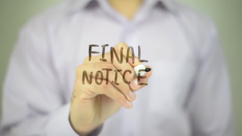 Writing Final Notice on Clear Surface