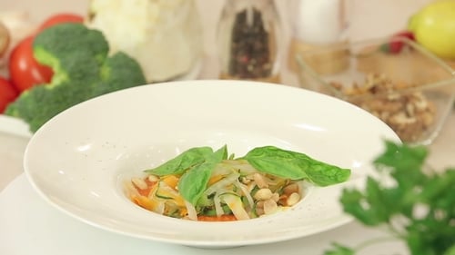 Fresh Salad with Herbs on Rotating Plate