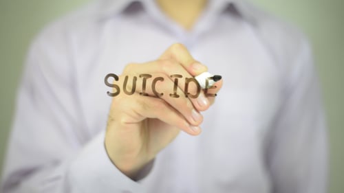 Person Writes Suicide on Glass with Marker