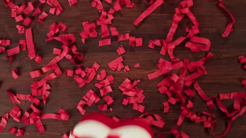 Heart Gift Box Surrounded by Red Confetti
