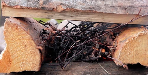 Traditional Wood Fire Pit Constructed with Firewood