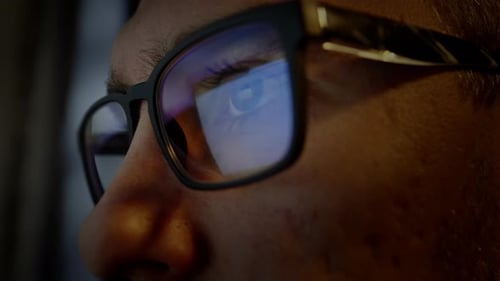 Man Wearing Glasses Reflecting Computer Screen