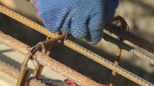 Securing Rebar with Wire and Pliers