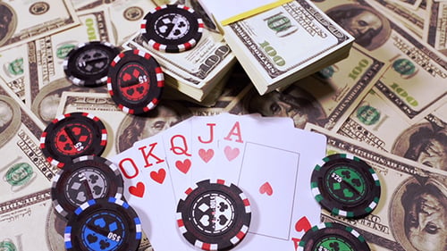 Poker Player Placing A Bet