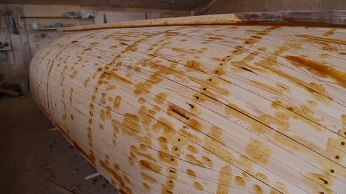 Wooden Boat Under Construction in Workshop