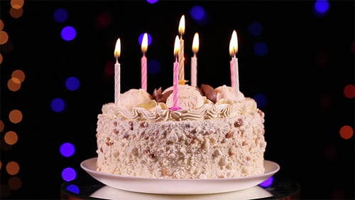 Delicious Cake with Lit Candles for Celebration