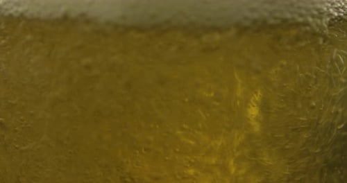 Beer Pouring into Glass Creates Foam