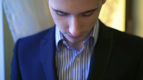 Portrait Of Serious Good-looking Man With Blue Eyes And Suit