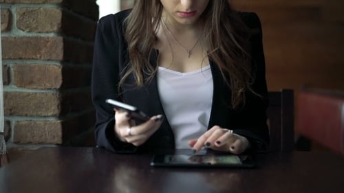 Model Sitting In Cafe And Talking On The Phone