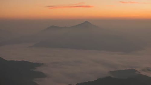 Aerial View of Mountains and Clouds at Sunrise