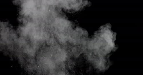 White Powder Explosion on Black Background