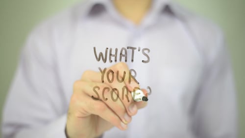 Hand Writing What's Your Score on Clear Surface