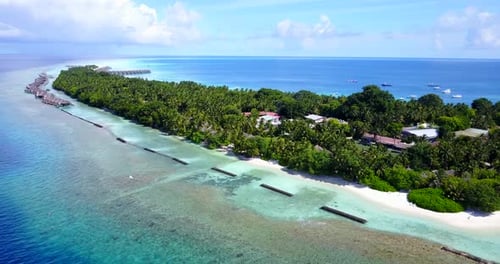 Luxury flying copy space shot of a paradise sunny white sand beach and blue sea background in colorf