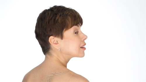 Woman with Short Hair Turns and Smiles