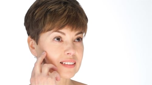 Woman Touches Her Face