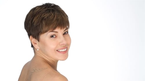 Young Woman Smiling and Looking Over Her Shoulder