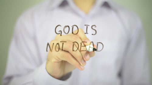 Hand Writes God Is Not Dead Message