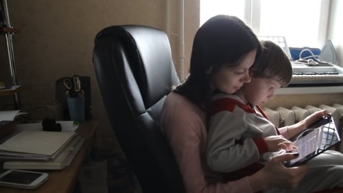 Child and Adult Using Tablet Device Together