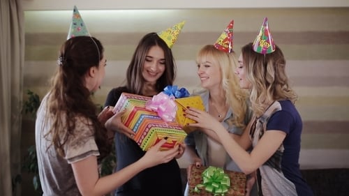 Friends Celebrate Birthday with Gifts and Hugs