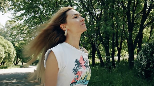 Girl Skates In The Park At Sunny Day