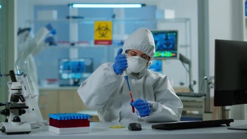 Scientist Conducting Research in Protective Hazmat Suit