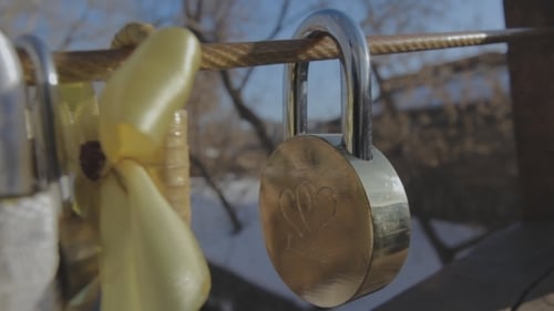 Padlock On The Bridge Of a Loving Couple