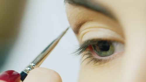 Woman Having Eyeshadow Applied Close Up