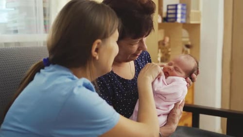 Three Generations: Baby with Grandmother and Young Adult