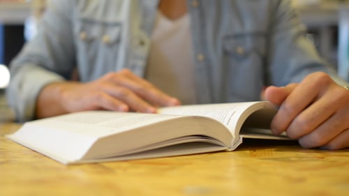 Reading Book and Turning Page